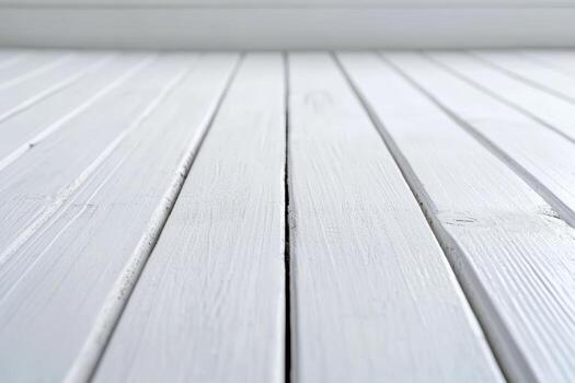 Smooth, white wooden floor showing texture and patterns in natural light photo