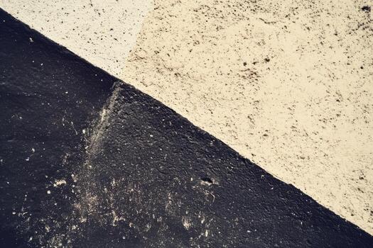 Textured wall with contrasting colors in urban setting during daylight photo