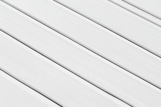 White wooden planks arranged in a parallel pattern on a surface photo