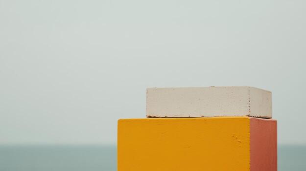 Colorful stacked blocks near the ocean on a cloudy day photo