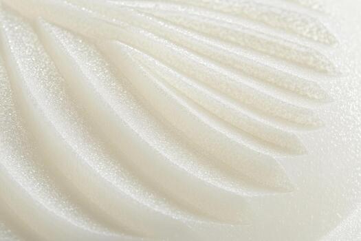 Detailed close-up of a textured white surface with elegant curves photo