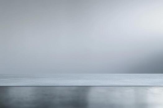Smooth gray and reflective surface with soft gradient background photo