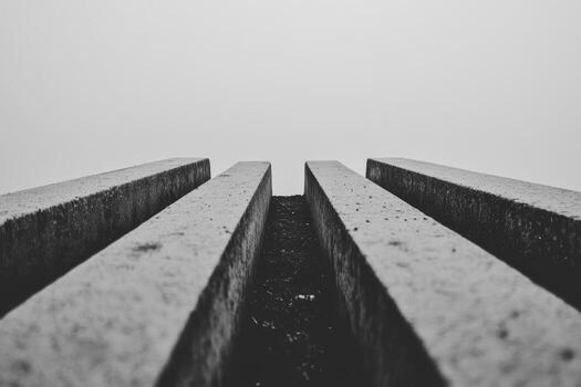 Concrete lines leading to misty horizon in monochrome setting photo