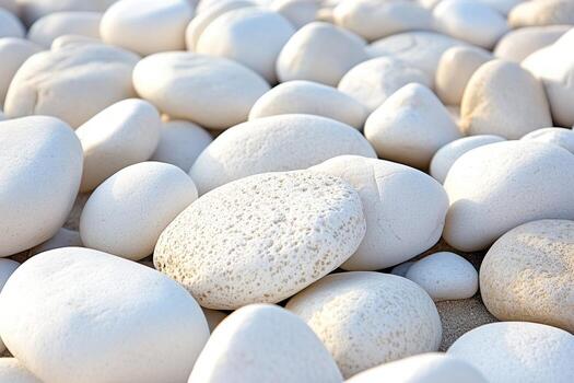White stones create a serene pattern on the sandy beach at sunrise photo