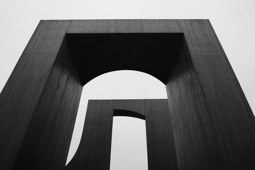 Concrete architecture shaped with geometric forms under a cloudy sky photo