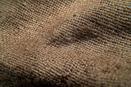 Close-up examination of natural burlap fabric texture and weave patterns photo