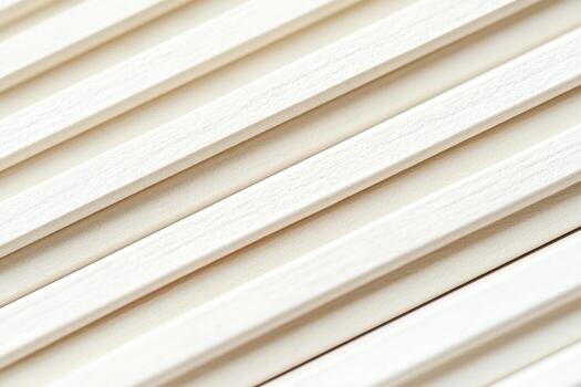 Wooden slats arranged in parallel lines on a textured surface photo