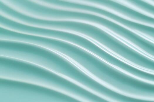 Wavy patterns create a calming texture on smooth aqua surface photo