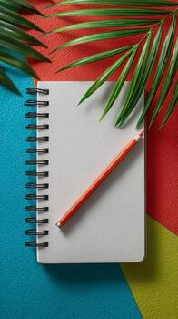 Brightly Colored Desk With a Blank Notebook and Pencil on Textured Paper. photo