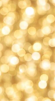 Soft golden bokeh lights create an abstract luminous background with warm glowing circles photo