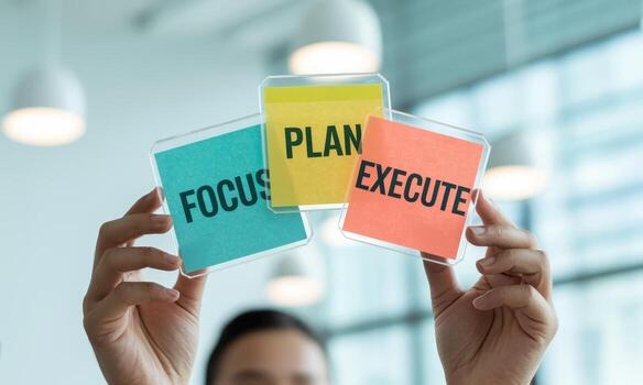 Hands holding transparent notes with words focus, plan, execute for business strategy photo
