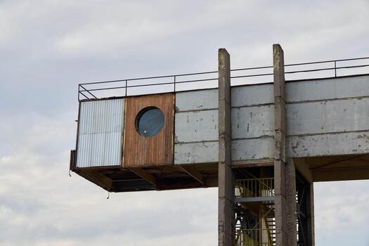 A Unique Architectural Abstract Featuring a Circular Window and Distinct Concrete Structure photo