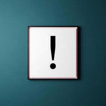 A framed exclamation point on a teal wall creating a simple yet striking visual statement with contrast photo