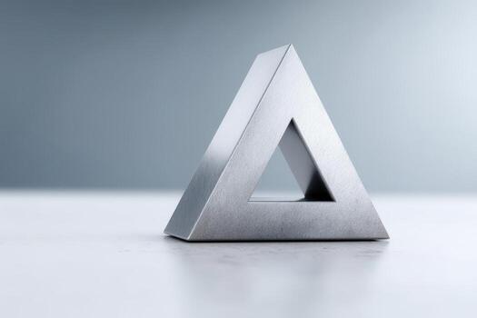 Geometric sculpture displays interlocking triangular design in modern space photo