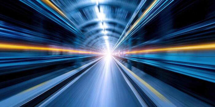 Dynamic perspective of a brightly lit tunnel, creating a sense of rapid movement and speed. photo