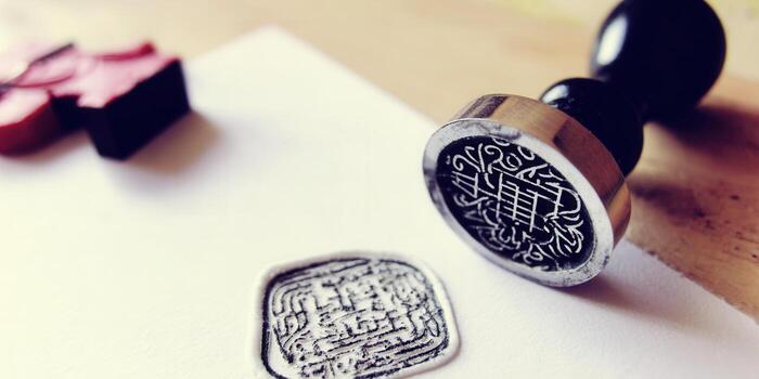 A close-up captures a detailed seal stamp, a symbol of official documentation. photo