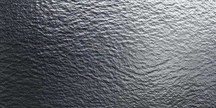 The image showcases a detailed, textured, and metallic surface with a rough and industrial appearance. photo