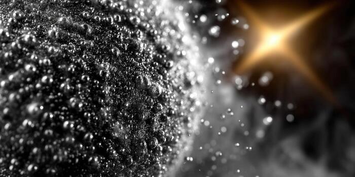 A striking macro shot features reflective spheres and a dramatic, blurred light source. photo