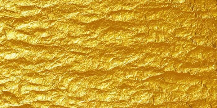 Crumpled golden foil creates a luxurious and textured background, perfect for design projects. photo