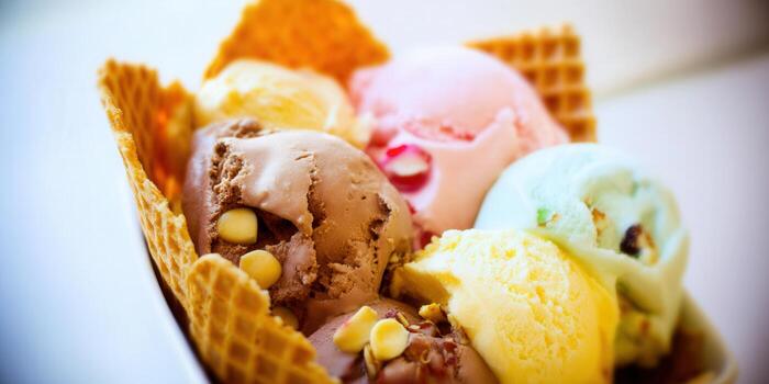Close-up of a delicious waffle bowl filled with assorted ice cream scoops. photo
