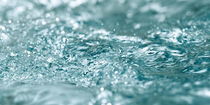 Intricate details of water in motion create a captivating visual experience with subtle blue tones. photo
