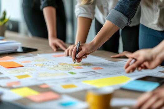 People working on a project with sticky notes photo