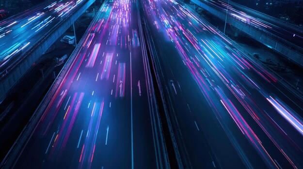 Aerial View of Highway Traffic at Night with Light Trails in a Modern Urban Setting photo