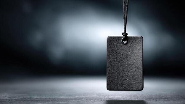 Blank Black Tag Mockup Hanging with a Rope for Branding and Pricing Display photo