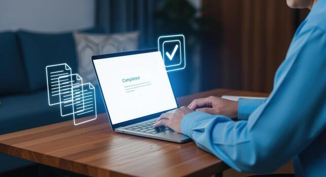 Online Document Completion A Person Finalizing Paperwork on a Laptop with Digital Confirmation photo