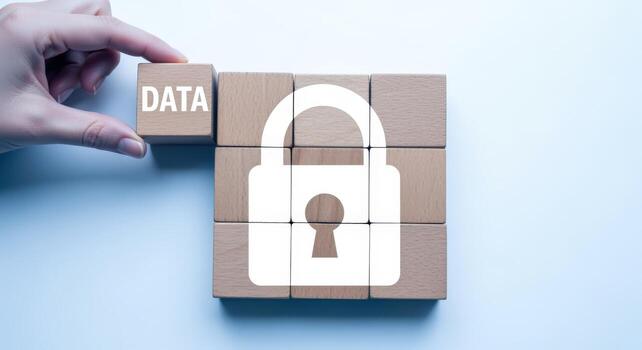 Data Security Concept Hand Placing Wooden Block with Data Beside Padlock Formed by Blocks photo