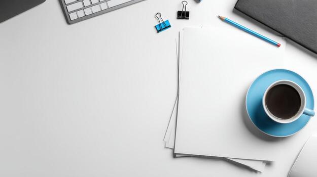 Top View of Office Desk with Coffee, Stationery and Blank Paper for Mockup photo