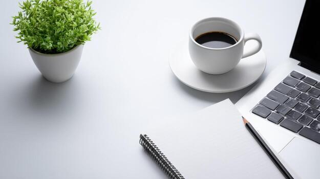 Workspace Flat Lay with Coffee, Laptop, Notepad, and Plant on White Background Offering Ample Copy Space photo