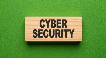 Cybersecurity Concept on Wooden Block Against Green Background for Data Protection and Digital Safety photo