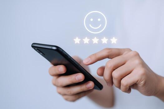 Customer Feedback on Mobile Device with Five Star Rating Graphic Overlay, Shows Positive User Experience photo