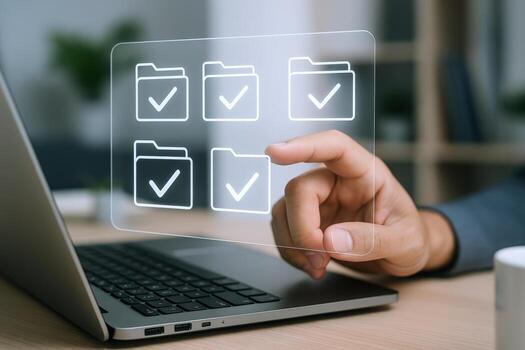File Management System Hand Interacting with Digital Folders on Laptop Screen, Illustrating Document Organization photo