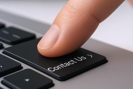 Finger Pressing Contact Us Button on Keyboard Reaching Out, Support, and Communication photo