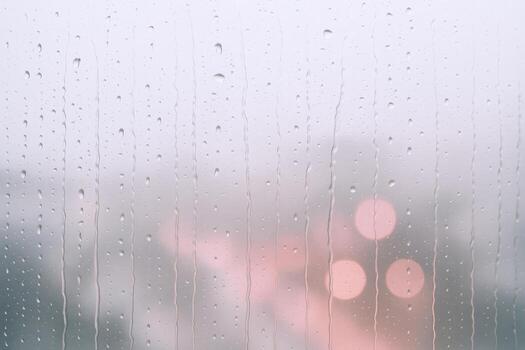 Raindrops on Glass Evoking Atmosphere, Reflection, and a Sense of Calm on a Misty Day photo
