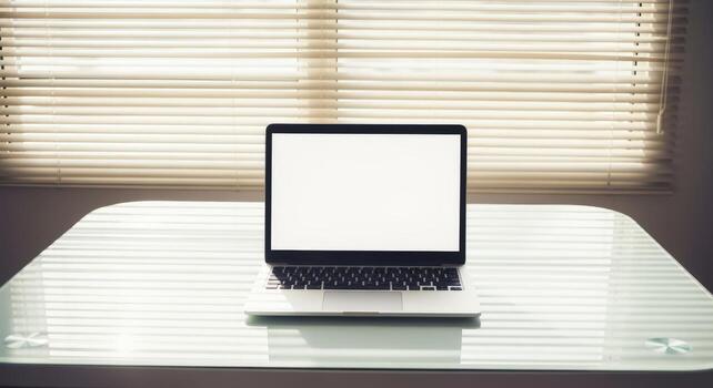 Laptop with Blank Screen on Glass Table, Minimalist Workspace Mockup, Window Background photo