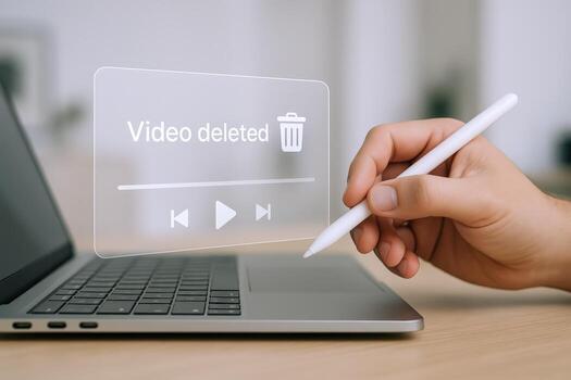 Deleted Notification on Laptop Screen Data Loss Concept with Stylus in Hand photo