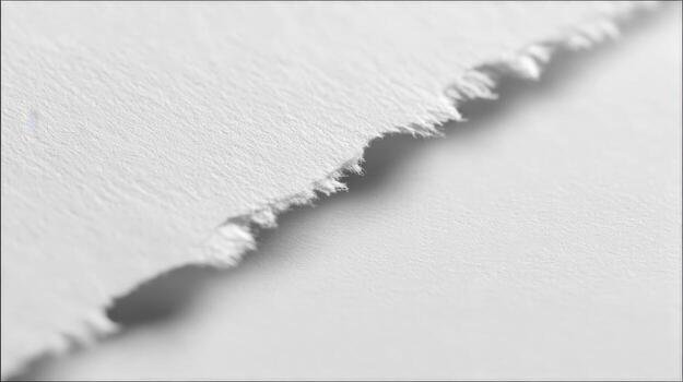 Torn Paper Edge Close-Up Revealing Texture and Fiber Detail, Ideal for Backgrounds and Graphic Elements photo