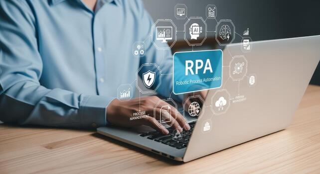 Man Working on Laptop with RPA Robotic Process Automation Technology for Business Efficiency photo