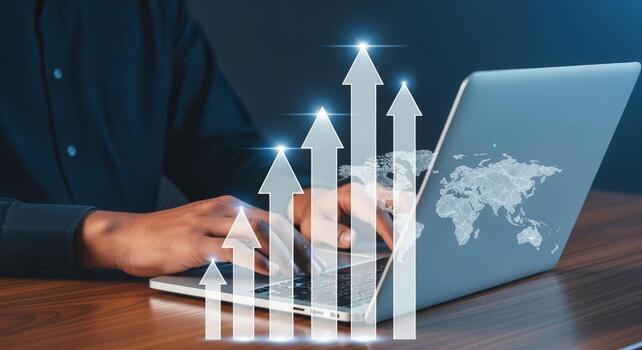 Analyzing Business Growth on Laptop with Rising Arrows and World Map Overlay for Global Expansion photo