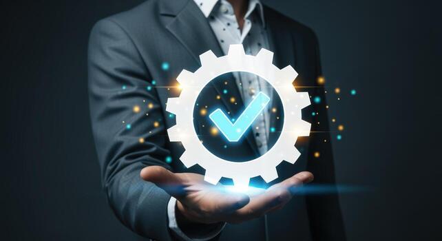 Quality Assurance Concept with Gear and Checkmark Icon Displayed by a Businessman in Suit photo