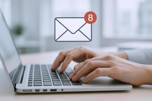 Business Professional Checking Inbox with Eight New Emails on Laptop for Efficient Communication photo