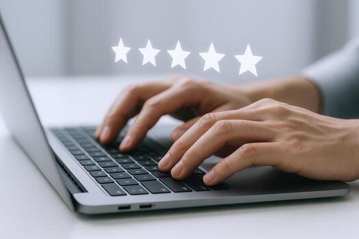 Customer Reviews and Feedback Shown in Five Star Rating While Typing on Laptop photo