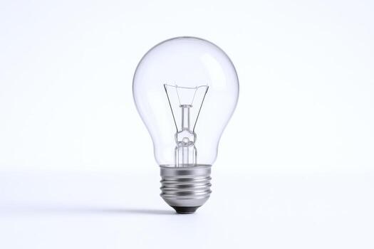 Clear Lightbulb on White Background Illustrating Idea Generation and Innovation Concepts photo