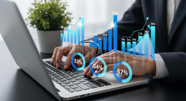 Financial Analyst Reviewing Data Analytics and Business Intelligence Visualizations on a Laptop Computer photo