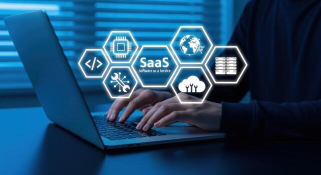 Software as a Service Concept Man Using Laptop with SaaS Icons Overlayed, Representing Cloud Computing and Business Solutions photo