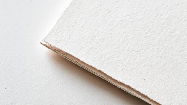 Close-Up of White Paper Textured Surface with Deckle Edge for Artistic and Design Projects photo