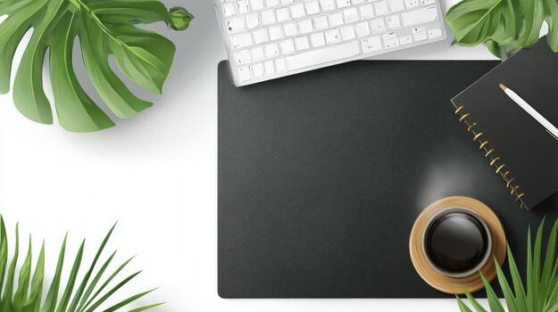 Workspace with black pad, keyboard, notebook, pencil and coffee surrounded by Monstera and Palm leaves photo